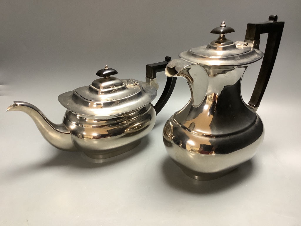 A four piece plated tea set and plated teaspoons.